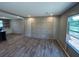 Spacious living room with stylish paneling and wood-look flooring at 4720 Oak St, Fruitland Park, FL 34731
