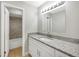 Bathroom featuring modern vanity with granite countertop and access to tiled shower/tub at 520 Eagle Cir, Casselberry, FL 32707