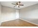 Cozy bedroom with ceiling fan, wood-style flooring, and fresh neutral paint at 520 Eagle Cir, Casselberry, FL 32707