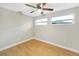 Bedroom featuring wood flooring, a ceiling fan, and great natural light at 520 Eagle Cir, Casselberry, FL 32707