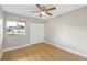 Bedroom with hardwood floors, neutral walls, ceiling fan and natural light from a window at 520 Eagle Cir, Casselberry, FL 32707
