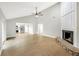Bright living room with vaulted ceilings, fireplace and light-colored wood flooring at 520 Eagle Cir, Casselberry, FL 32707