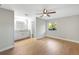 Light-filled main bedroom with modern ceiling fan and attached en-suite bathroom at 520 Eagle Cir, Casselberry, FL 32707
