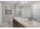 Bright bathroom features a window and a large mirror above the vanity at 525 Garden Heights Dr, Winter Garden, FL 34787