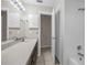 Clean bathroom with white cabinets, tile flooring, and updated fixtures at 525 Garden Heights Dr, Winter Garden, FL 34787