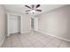 Bedroom featuring tile flooring and a closet at 525 Garden Heights Dr, Winter Garden, FL 34787