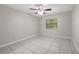 Bedroom featuring tile flooring and a large window at 525 Garden Heights Dr, Winter Garden, FL 34787
