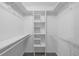 Walk-in closet with shelves and wire racks for ample storage at 525 Garden Heights Dr, Winter Garden, FL 34787