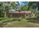 Home exterior view showing the screened-in porch and expansive backyard at 525 Garden Heights Dr, Winter Garden, FL 34787