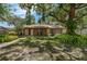 Charming single-story home with a well-maintained lawn and mature trees providing ample shade at 525 Garden Heights Dr, Winter Garden, FL 34787