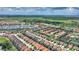 Expansive aerial view of a residential community showcasing lush green spaces and well-maintained homes at 5368 Oakbourne Ave, Davenport, FL 33837