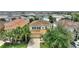 Stunning aerial view of a two story home, showcasing the driveway and front yard at 5368 Oakbourne Ave, Davenport, FL 33837