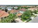Beautiful aerial view of a well-maintained home with a tiled roof and mature landscaping at 5368 Oakbourne Ave, Davenport, FL 33837