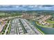 Overhead aerial view of the neighborhood adjacent to a lake and featuring a well-planned community layout at 5368 Oakbourne Ave, Davenport, FL 33837