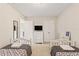 Cozy bedroom with twin beds, neutral-colored walls, and plenty of closet space at 5368 Oakbourne Ave, Davenport, FL 33837