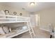 Comfortable ' bedroom with bunk beds, carpet and an adjoining bathroom at 5368 Oakbourne Ave, Davenport, FL 33837