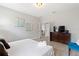 Main bedroom with tile flooring, a large dresser, and a bright and airy atmosphere at 5368 Oakbourne Ave, Davenport, FL 33837