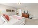 Neutral main bedroom with soft carpet, king bed, warm lighting, and stylish decor at 5368 Oakbourne Ave, Davenport, FL 33837