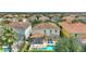 Back of home featuring screened-in private pool, patio, and lounge chairs perfect for relaxing in the Florida sun at 5368 Oakbourne Ave, Davenport, FL 33837