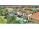 Back of home featuring screened-in private pool and patio with lots of lush greenery and space for entertaining at 5368 Oakbourne Ave, Davenport, FL 33837