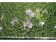 A wooded property with a home, pool, and tennis court is captured from above at 546 Winona Dr, Geneva, FL 32732