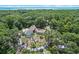 Aerial view of home and pool area amidst trees, offering a private retreat at 546 Winona Dr, Geneva, FL 32732