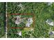 From above, see a property with home, pool, and tennis court within a red border at 546 Winona Dr, Geneva, FL 32732