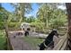 Enclosed pen featuring livestock and small outbuilding, perfect for animals in this country setting at 546 Winona Dr, Geneva, FL 32732