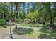 A serene pond filled with lilies, surrounded by lush greenery at 546 Winona Dr, Geneva, FL 32732