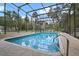 Relaxing in-ground pool enclosed with a screen, perfect for year-round enjoyment at 546 Winona Dr, Geneva, FL 32732