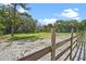 Expansive property with a wooden fence, mature trees and lush foliage at 546 Winona Dr, Geneva, FL 32732