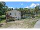 Back exterior showcasing a home with an attached pool, deck and stairs at 546 Winona Dr, Geneva, FL 32732