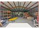 Open metal beam shed, with kayak, shelving and various items at 546 Winona Dr, Geneva, FL 32732
