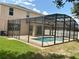 Enjoy the backyard pool with a screened enclosure at 5917 Coquyt Dr, Mount Dora, FL 32757