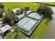 Aerial view of tennis and basketball courts in the well-maintained amenity center of the community at 5917 Coquyt Dr, Mount Dora, FL 32757