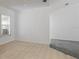 Bright bedroom with light-colored walls, neutral flooring, and a large window at 5990 Se 5Th Pl, Ocala, FL 34472