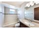 Clean bathroom with a shower-tub combination, tile walls, and a granite vanity at 6835 Massa Ct, Orlando, FL 32810