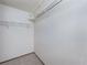 Walk-in closet featuring neutral carpet and white walls with wire shelving for storage at 6835 Massa Ct, Orlando, FL 32810