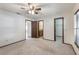 Carpeted main bedroom with multiple closets and ensuite bathroom entrance at 6835 Massa Ct, Orlando, FL 32810