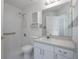 This well-lit bathroom offers a walk-in shower and built in vanity at 710 Independence Dr, Orange City, FL 32763