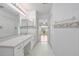 En suite bath includes a large mirror and vanity with lots of storage at 710 Independence Dr, Orange City, FL 32763