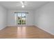 Sun-filled bedroom with window, and laminate floors at 710 Independence Dr, Orange City, FL 32763
