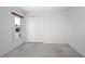 A bright bedroom features carpet, a window, and a closet with bi-fold doors at 710 Independence Dr, Orange City, FL 32763