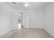 Neutral carpet and white walls provide a blank slate in this bedroom with adjoining room at 710 Independence Dr, Orange City, FL 32763
