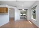 Bright dining area with views of the backyard through sliding glass doors, next to open kitchen at 710 Independence Dr, Orange City, FL 32763