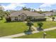 Inviting home with a lush lawn and manicured shrubbery at 710 Independence Dr, Orange City, FL 32763