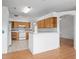Open kitchen showcases tile floors, oak cabinetry, a breakfast bar, and a seamless transition to the living area at 710 Independence Dr, Orange City, FL 32763