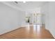 Bright living room with hardwood flooring, neutral paint, and view of the front door at 710 Independence Dr, Orange City, FL 32763