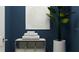 Stylish bathroom with a stack of soft towels and a decorative plant at 7374 Ivy Tendril Ave, Orlando, FL 32829