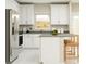 Bright kitchen featuring stainless steel appliances, an island, and ample storage at 7374 Ivy Tendril Ave, Orlando, FL 32829